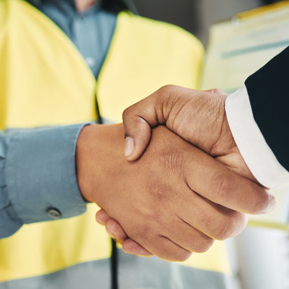 Two men shaking hands over CBP reconciliation